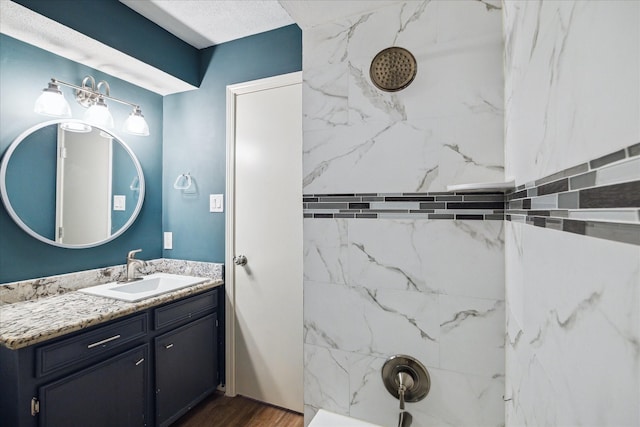 13603 Woodchester Dr, Sugar Land, TX 77498 - full bath featuring a shower, vanity, and wood finished floors