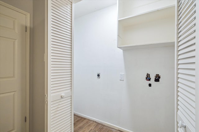 13603 Woodchester Dr, Sugar Land, TX 77498 - washroom featuring electric dryer hookup and light wood-style floors
