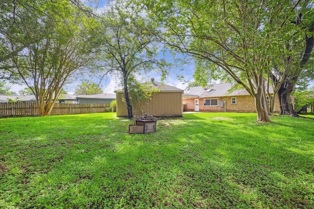 13603 Woodchester Dr, Sugar Land, TX 77498 - view of yard featuring a storage unit