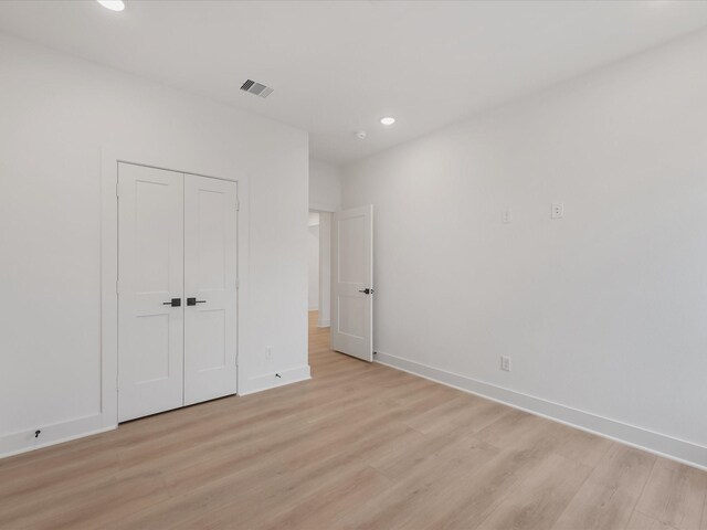 5016 Golden Forest Dr, Houston, TX 77091 - unfurnished bedroom featuring recessed lighting, light wood-style floors, baseboards, and a closet