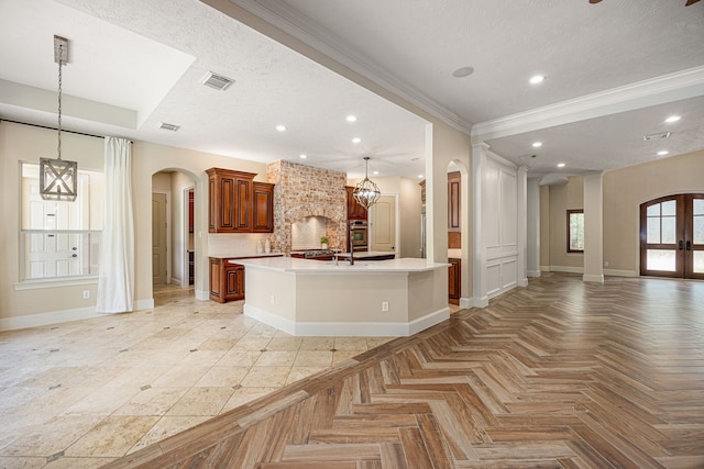24914 Misty Heath Ln, Katy, TX 77494 - kitchen featuring arched walkways, open floor plan, oven, baseboards, and light countertops