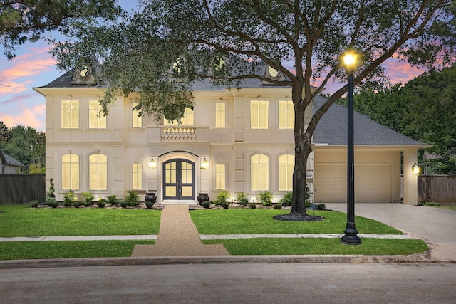 24914 Misty Heath Ln, Katy, TX 77494 - view of front of home with french doors, concrete driveway, an attached garage, and a shingled roof