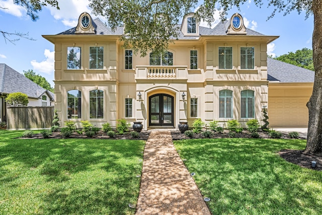 24914 Misty Heath Ln, Katy, TX 77494 - view of front of property featuring french doors, a shingled roof, a balcony, an attached garage, and stucco siding