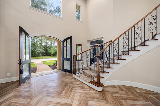 24914 Misty Heath Ln, Katy, TX 77494 - foyer entrance with french doors, baseboards, plenty of natural light, a high ceiling, and stairs