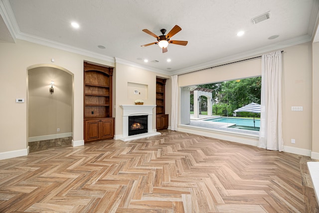 24914 Misty Heath Ln, Katy, TX 77494 - unfurnished living room featuring ceiling fan, baseboards, a glass covered fireplace, built in features, and recessed lighting