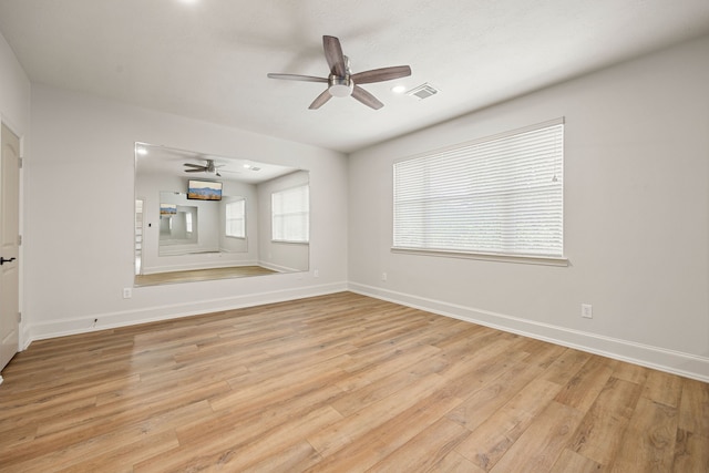 24914 Misty Heath Ln, Katy, TX 77494 - unfurnished living room with a ceiling fan, light wood finished floors, and baseboards