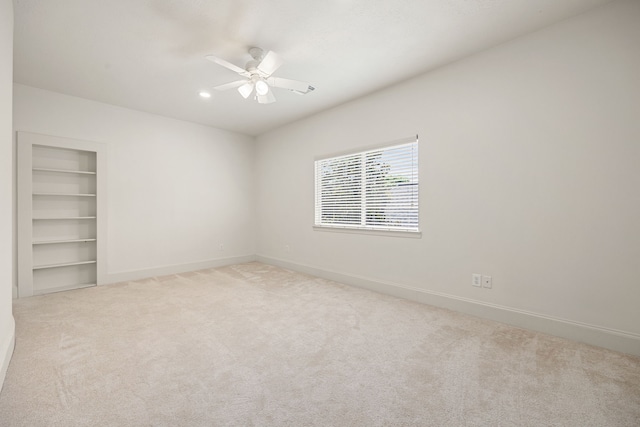 24914 Misty Heath Ln, Katy, TX 77494 - empty room featuring a ceiling fan, baseboards, carpet floors, built in features, and recessed lighting