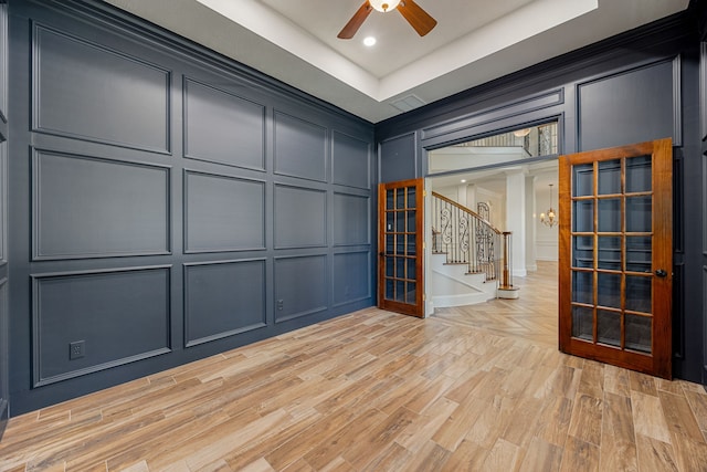 24914 Misty Heath Ln, Katy, TX 77494 - empty room featuring a decorative wall, stairs, a ceiling fan, light wood-style floors, and recessed lighting