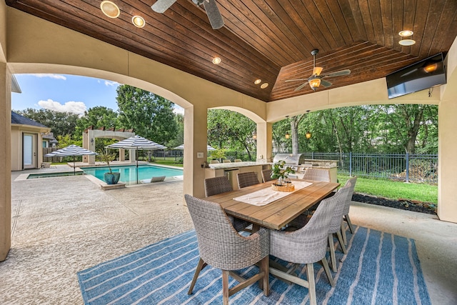 24914 Misty Heath Ln, Katy, TX 77494 - view of patio featuring a ceiling fan, outdoor dining area, and view of scattered trees