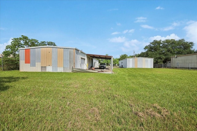 2432 Westpine Rd, Beaumont, TX 77713 - rear view of property featuring an outbuilding and a carport