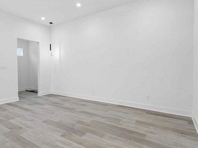 1266-1264 Finnigan St, Houston, TX 77020 - spare room with recessed lighting, light wood-style floors, and baseboards