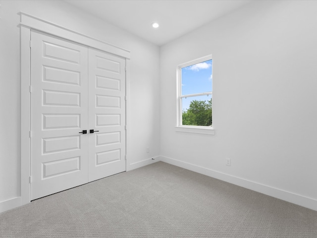 1266-1264 Finnigan St, Houston, TX 77020 - unfurnished bedroom featuring carpet flooring, baseboards, a closet, and recessed lighting