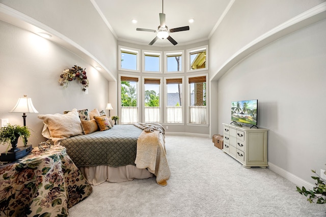1003 Angel Forest Ct, Pinehurst, TX 77362 - bedroom featuring ornamental molding, light carpet, a high ceiling, and ceiling fan