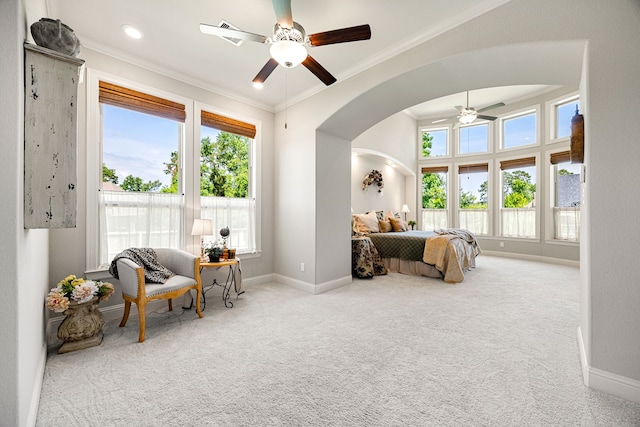 1003 Angel Forest Ct, Pinehurst, TX 77362 - carpeted bedroom with ornamental molding, arched walkways, and a ceiling fan
