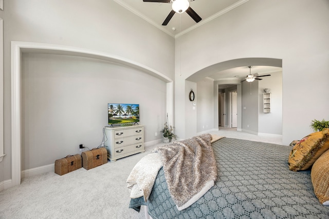 1003 Angel Forest Ct, Pinehurst, TX 77362 - carpeted bedroom with arched walkways, a ceiling fan, a high ceiling, and crown molding