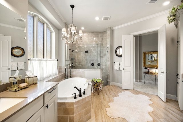 1003 Angel Forest Ct, Pinehurst, TX 77362 - full bath with a stall shower, a bath, vanity, ornamental molding, and wood finished floors