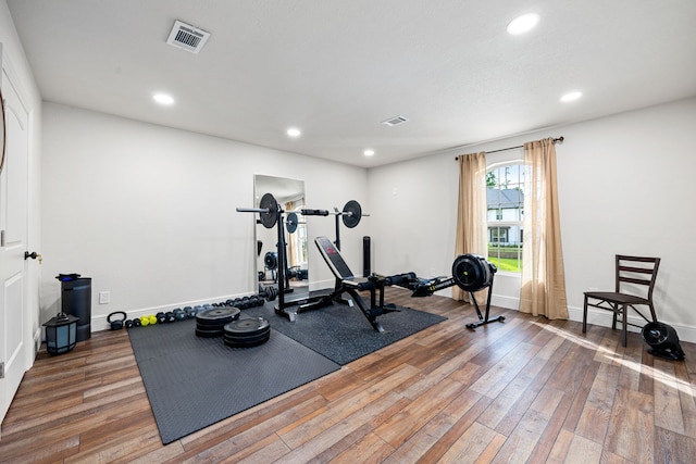 1003 Angel Forest Ct, Pinehurst, TX 77362 - workout room featuring hardwood / wood-style floors and recessed lighting