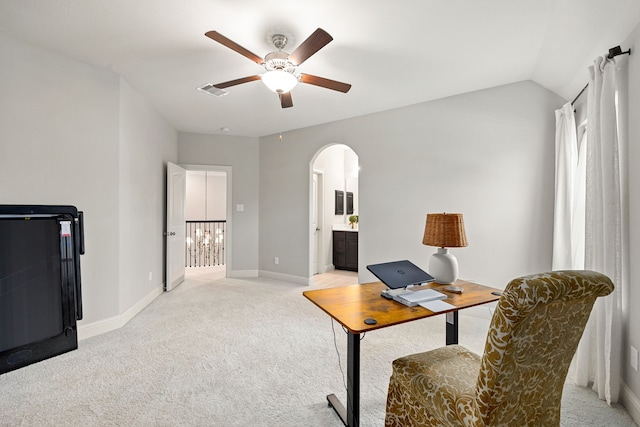 1003 Angel Forest Ct, Pinehurst, TX 77362 - home office featuring arched walkways, ceiling fan, light carpet, and vaulted ceiling