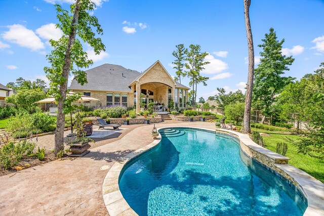 1003 Angel Forest Ct, Pinehurst, TX 77362 - swimming pool featuring a patio
