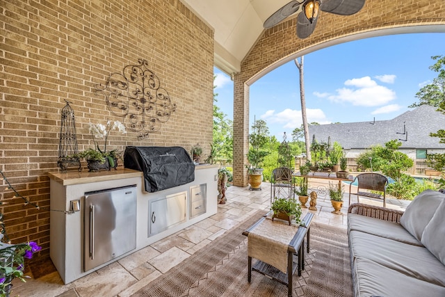 1003 Angel Forest Ct, Pinehurst, TX 77362 - view of patio / terrace with exterior kitchen, an outdoor hangout area, and ceiling fan