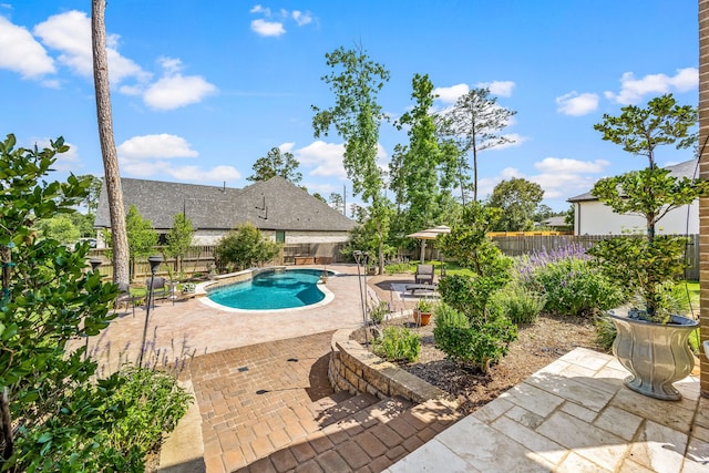 1003 Angel Forest Ct, Pinehurst, TX 77362 - view of pool with a patio and a fenced backyard