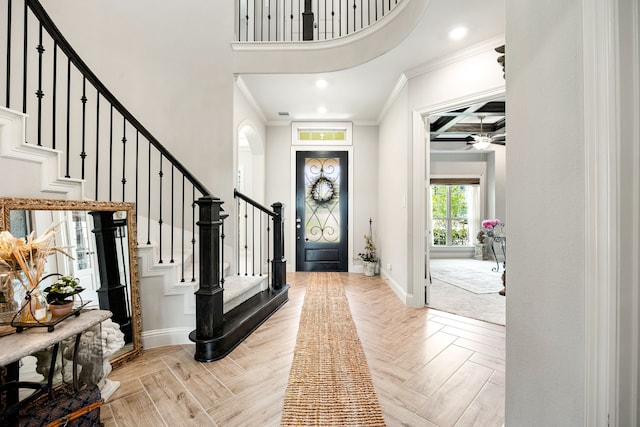 1003 Angel Forest Ct, Pinehurst, TX 77362 - foyer with crown molding, a high ceiling, stairs, and recessed lighting