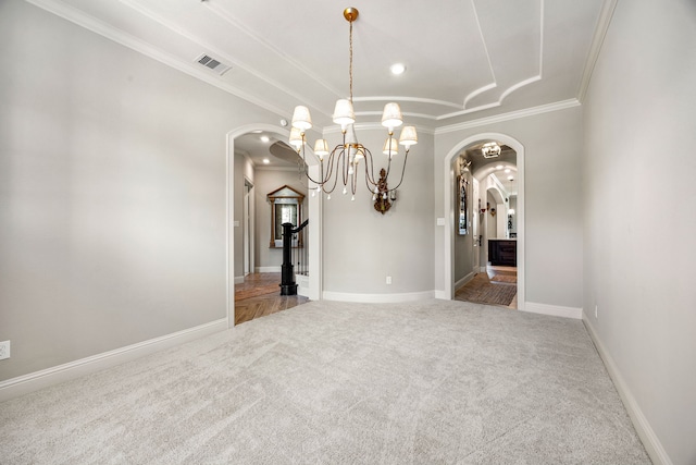 1003 Angel Forest Ct, Pinehurst, TX 77362 - carpeted spare room featuring arched walkways, ornamental molding, a chandelier, and recessed lighting