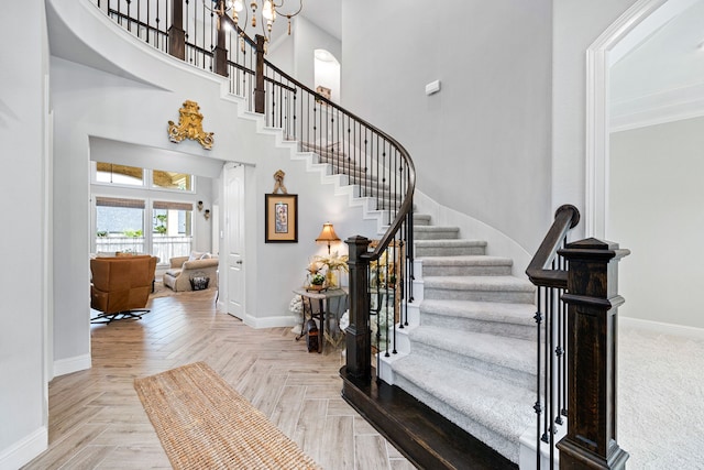 1003 Angel Forest Ct, Pinehurst, TX 77362 - entrance foyer featuring a towering ceiling and stairs