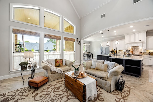 1003 Angel Forest Ct, Pinehurst, TX 77362 - living room with crown molding, high vaulted ceiling, arched walkways, and a chandelier