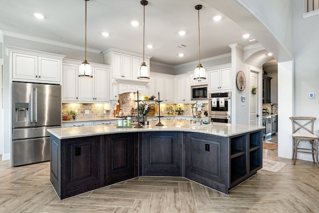 1003 Angel Forest Ct, Pinehurst, TX 77362 - kitchen with stainless steel appliances, white cabinetry, a spacious island, decorative backsplash, and light stone countertops
