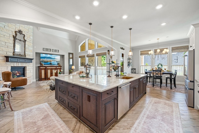 1003 Angel Forest Ct, Pinehurst, TX 77362 - kitchen featuring dishwasher, dark brown cabinets, a fireplace, plenty of natural light, and crown molding