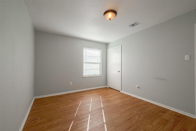 5619 Willow Glen Dr, Houston, TX 77033 - unfurnished room with light wood-type flooring and baseboards