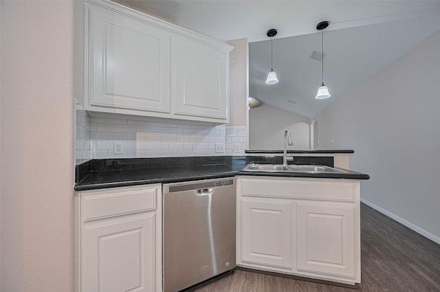 28861 Llano River Loop, Spring, TX 77386 - kitchen with dishwasher, a sink, dark countertops, dark wood-style floors, and vaulted ceiling