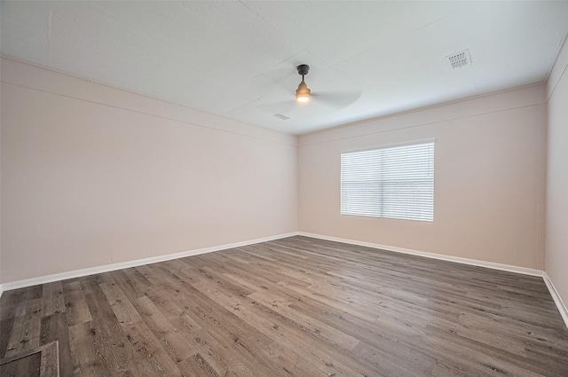 28861 Llano River Loop, Spring, TX 77386 - unfurnished room featuring wood finished floors, a ceiling fan, and baseboards