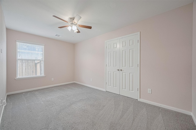 28861 Llano River Loop, Spring, TX 77386 - unfurnished bedroom with carpet flooring, baseboards, a closet, and ceiling fan