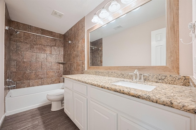28861 Llano River Loop, Spring, TX 77386 - full bathroom featuring toilet, washtub / shower combination, vanity, and wood finished floors