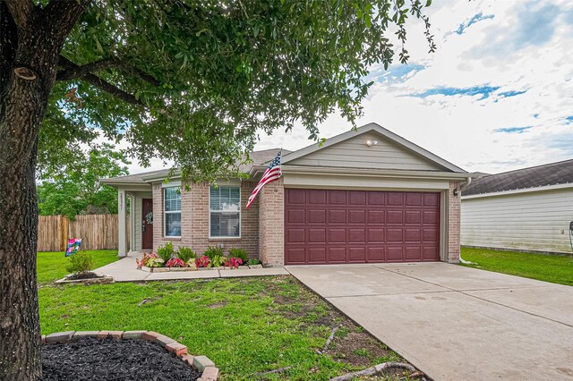 28861 Llano River Loop, Spring, TX 77386 - view of front of property featuring brick siding, a garage, and driveway