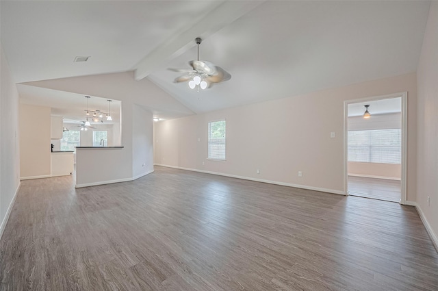 28861 Llano River Loop, Spring, TX 77386 - unfurnished living room featuring ceiling fan, wood finished floors, and baseboards