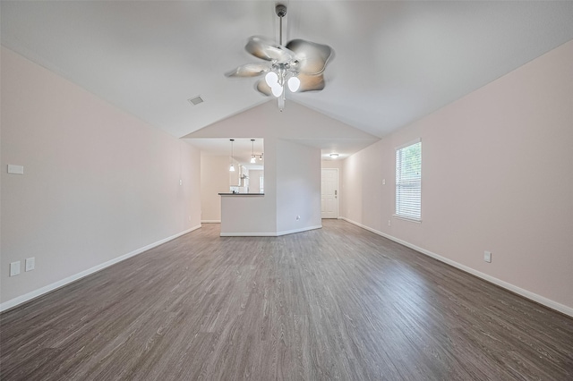 28861 Llano River Loop, Spring, TX 77386 - unfurnished living room featuring wood finished floors, ceiling fan, baseboards, and lofted ceiling