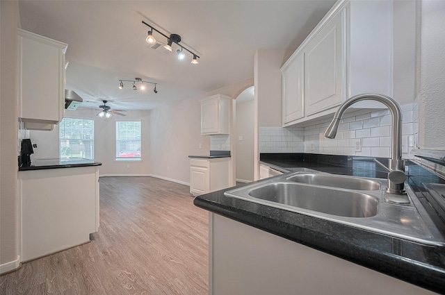 28861 Llano River Loop, Spring, TX 77386 - kitchen with a ceiling fan, white cabinetry, light wood-style floors, and dark countertops