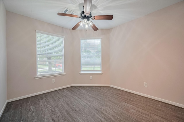 28861 Llano River Loop, Spring, TX 77386 - unfurnished room with dark wood-type flooring, a ceiling fan, and baseboards