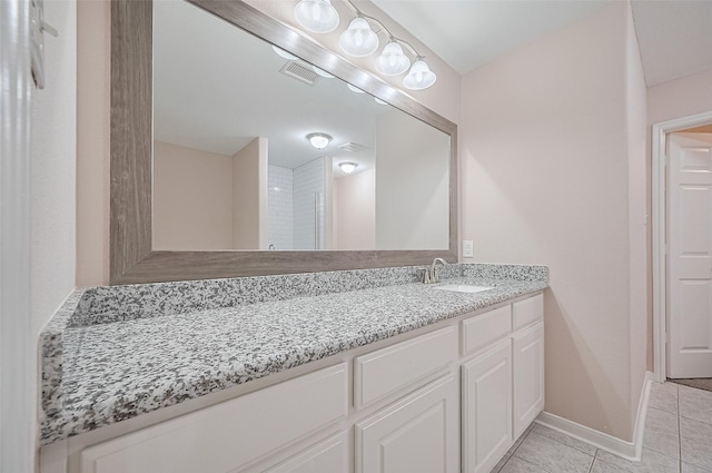 28861 Llano River Loop, Spring, TX 77386 - bathroom featuring vanity, tile patterned flooring, and baseboards