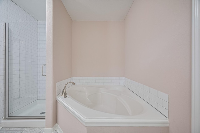 28861 Llano River Loop, Spring, TX 77386 - bathroom with a bath, a stall shower, and tile patterned flooring
