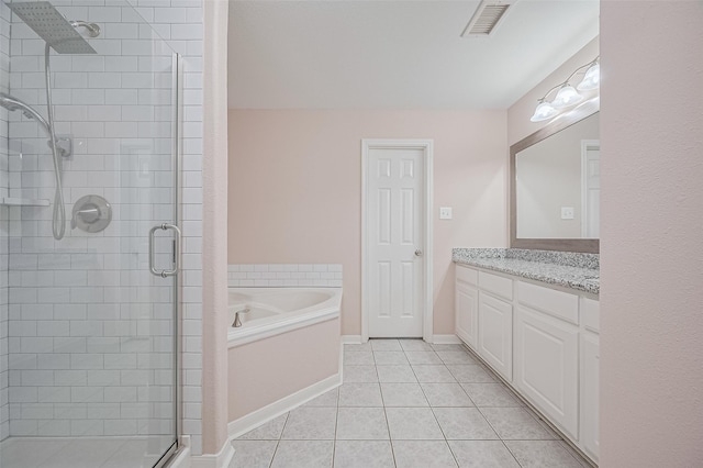 28861 Llano River Loop, Spring, TX 77386 - full bathroom with a stall shower, tile patterned floors, a garden tub, vanity, and baseboards