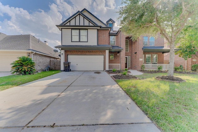 16411 Jadestone Terrace Ln, Houston, TX 77044 - view of front of house with brick siding, a garage, driveway, and board and batten siding
