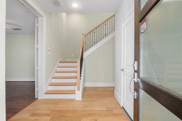 5421 Larkin St, Houston, TX 77007 - foyer entrance featuring stairway, wood finished floors, baseboards, and recessed lighting