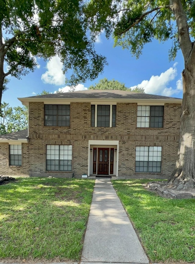 9827 Westminster Dr, Humble, TX 77338 - view of front of home with brick siding and a front lawn