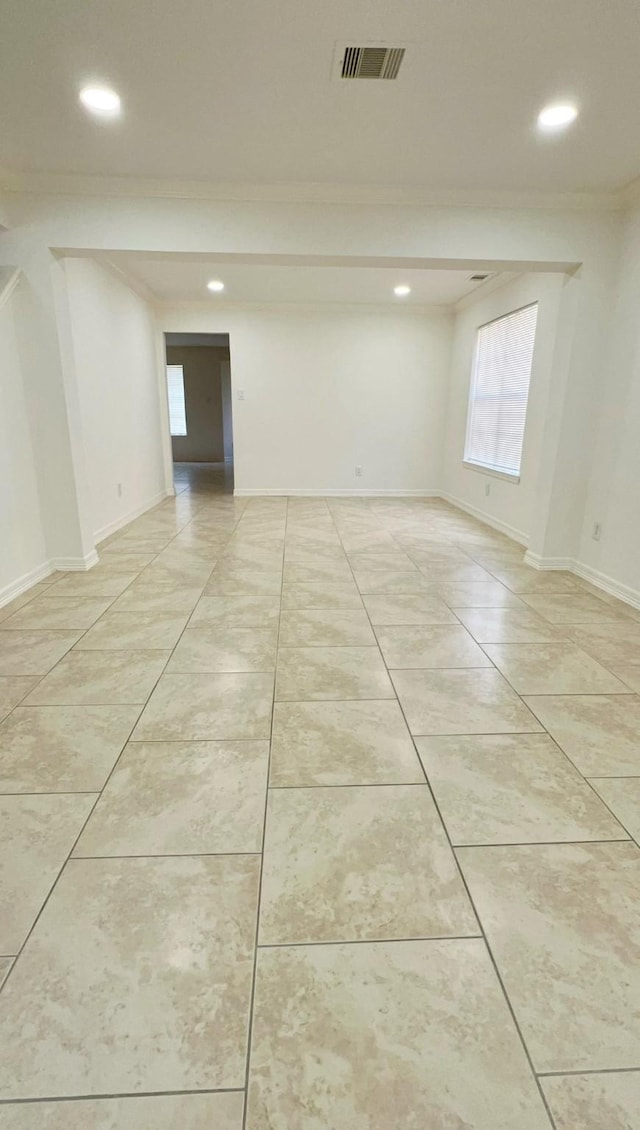 9827 Westminster Dr, Humble, TX 77338 - spare room featuring ornamental molding, recessed lighting, light tile patterned floors, and baseboards
