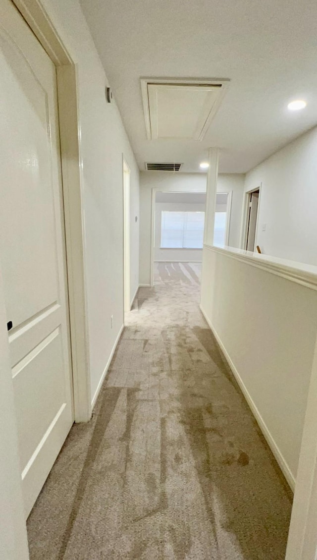 9827 Westminster Dr, Humble, TX 77338 - corridor featuring attic access, carpet, and baseboards