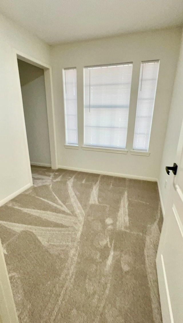 9827 Westminster Dr, Humble, TX 77338 - empty room with carpet floors and baseboards